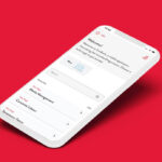 A mobile mockup of the Simbook app on a red background