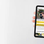 A photo of an iPad being held with the fiftyfitness website on it.